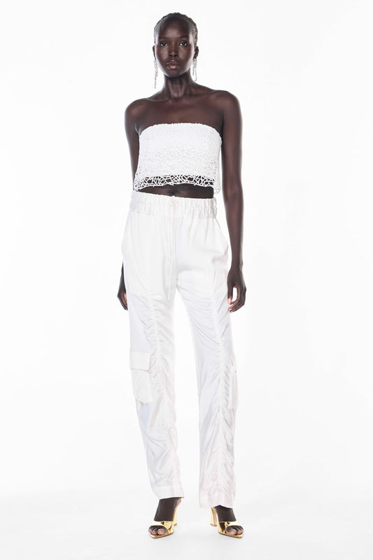 Image of a model wearing Pants. Productname: Off Duty Pant in WHITE colour by brand - Manning Cartell