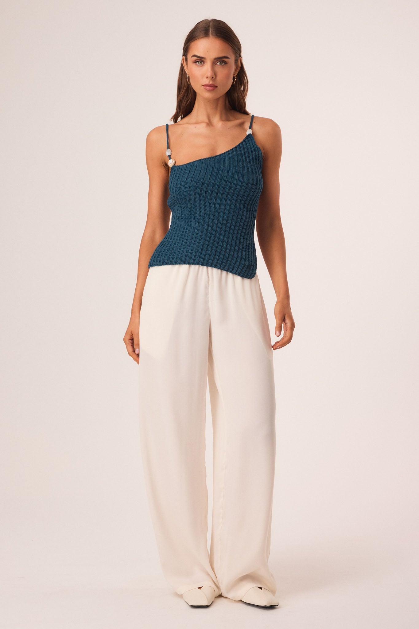 Image of a model wearing Tops. Productname: SNDYS DESI OPEN BACK TOP in Teal colour by brand - SNDYS