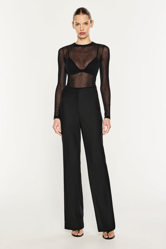 Image of a model wearing Tops. Product name - Mesh Squad L/S Top in Black colour by brand - MANNING CARTELL