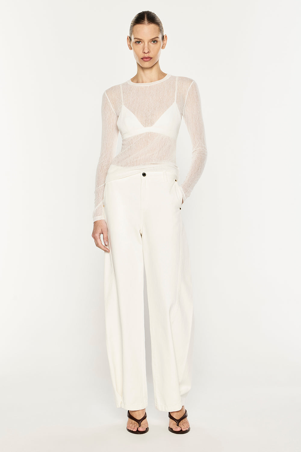 Image of a model wearing Tops. Product name - Mesh Squad L/S Top in White colour by brand - MANNING CARTELL