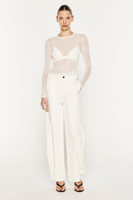 Image of a model wearing Tops. Product name - Mesh Squad L/S Top in White colour by brand - MANNING CARTELL