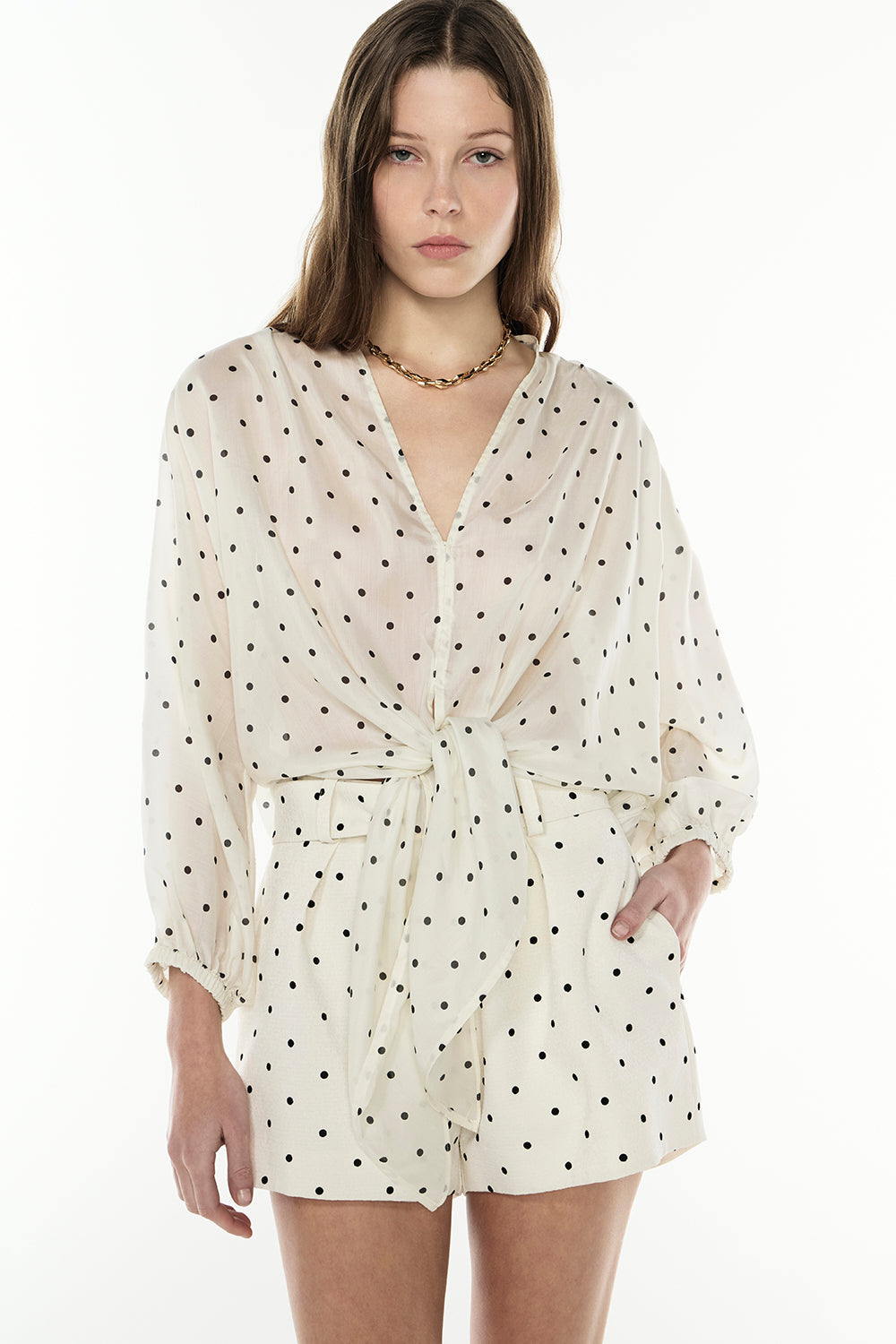Image of a model wearing Tops. Productname: Dot Dot Dash Top in IVORY/BLACK colour by brand - Manning Cartell