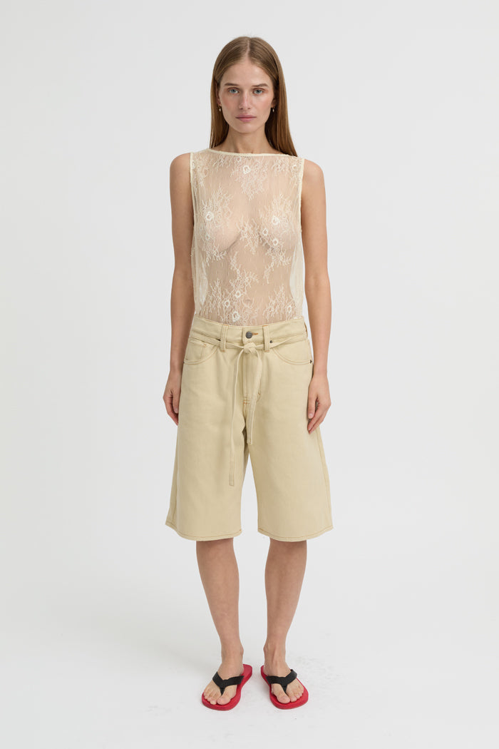Image of a model wearing Shorts. Product name - Tamsin Shorts Cream in Cream colour by brand - Blanca Studio