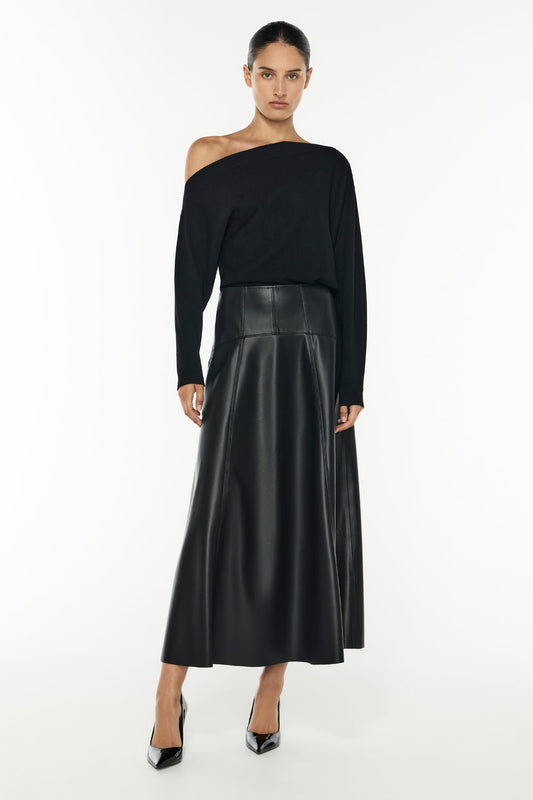 Image of a model wearing Tops. Productname: Future Feeling Knit Top in BLACK colour by brand - Manning Cartell