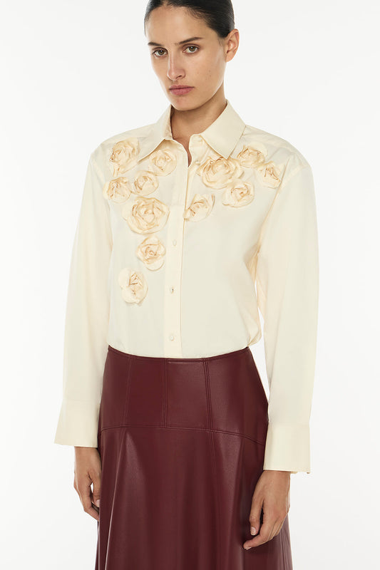 Image of a model wearing Tops. Productname: Sweet Sererity Rosette Shirt in Butter colour by brand - Manning Cartell