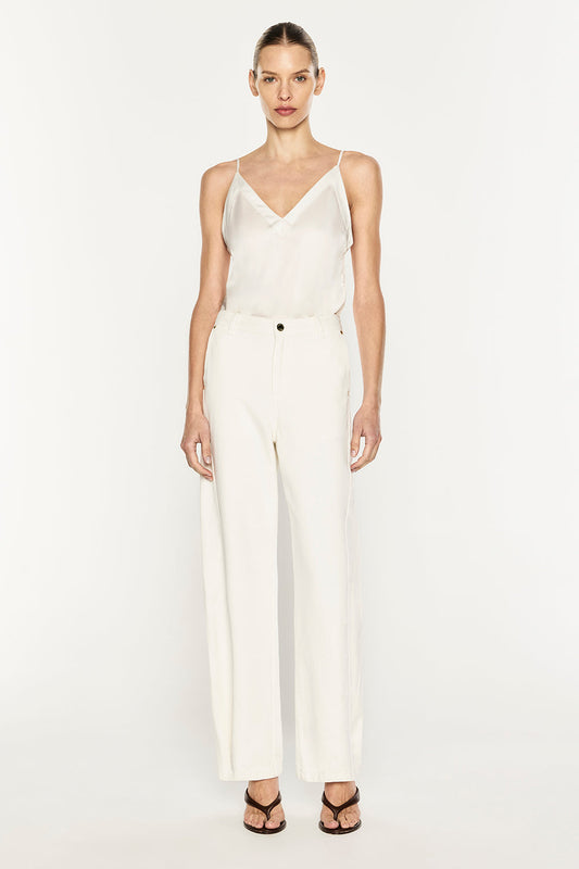 Image of a model wearing Tops. Product name - Under All Cami in Ivory colour by brand - MANNING CARTELL