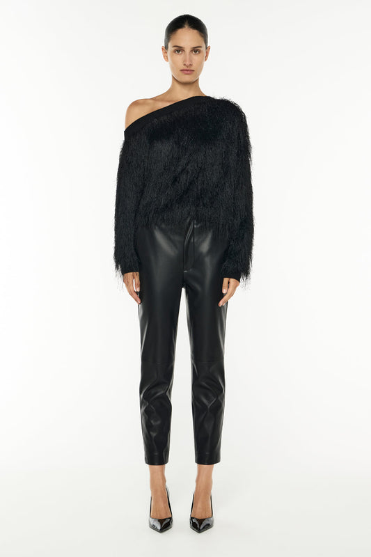 Image of a model wearing Tops. Productname: On The Fringe Knit Top in Black colour by brand - Manning Cartell