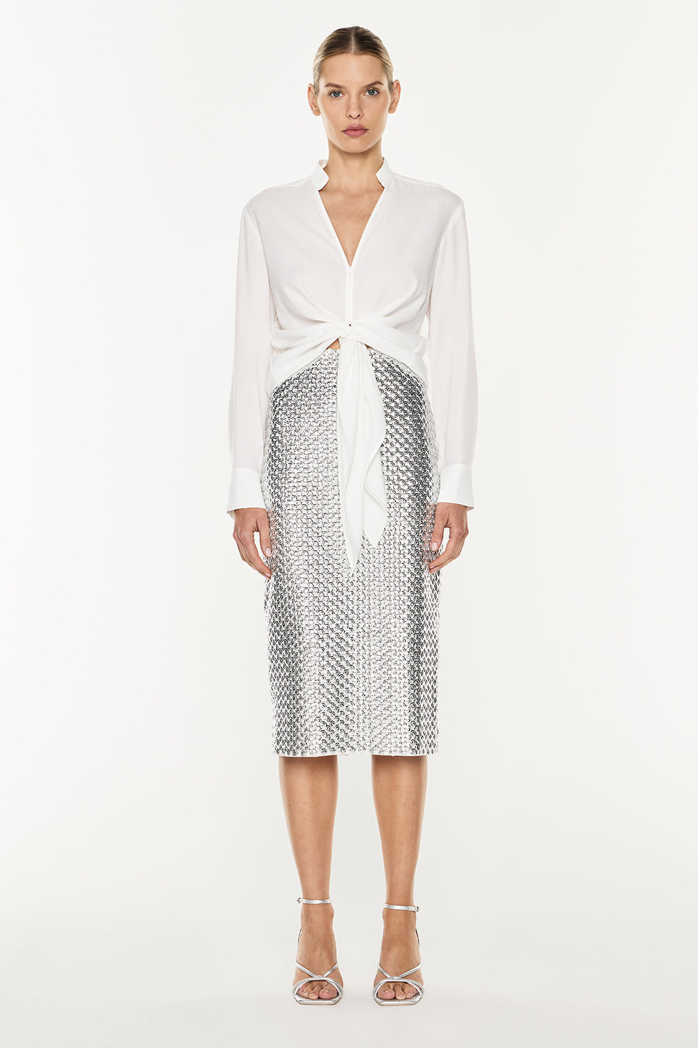 Image of a model wearing Skirts. Product name - Opulent Scale Skirt in Silver colour by brand - MANNING CARTELL