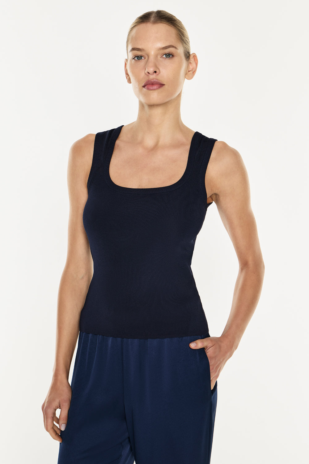Image of a model wearing Tops. Productname: Go Figure Knit Tank in Navy colour by brand - Manning Cartell