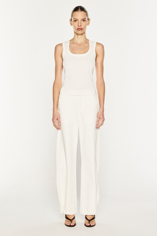 Image of a model wearing Tops. Product name - Go Figure Knit Tank in White colour by brand - MANNING CARTELL