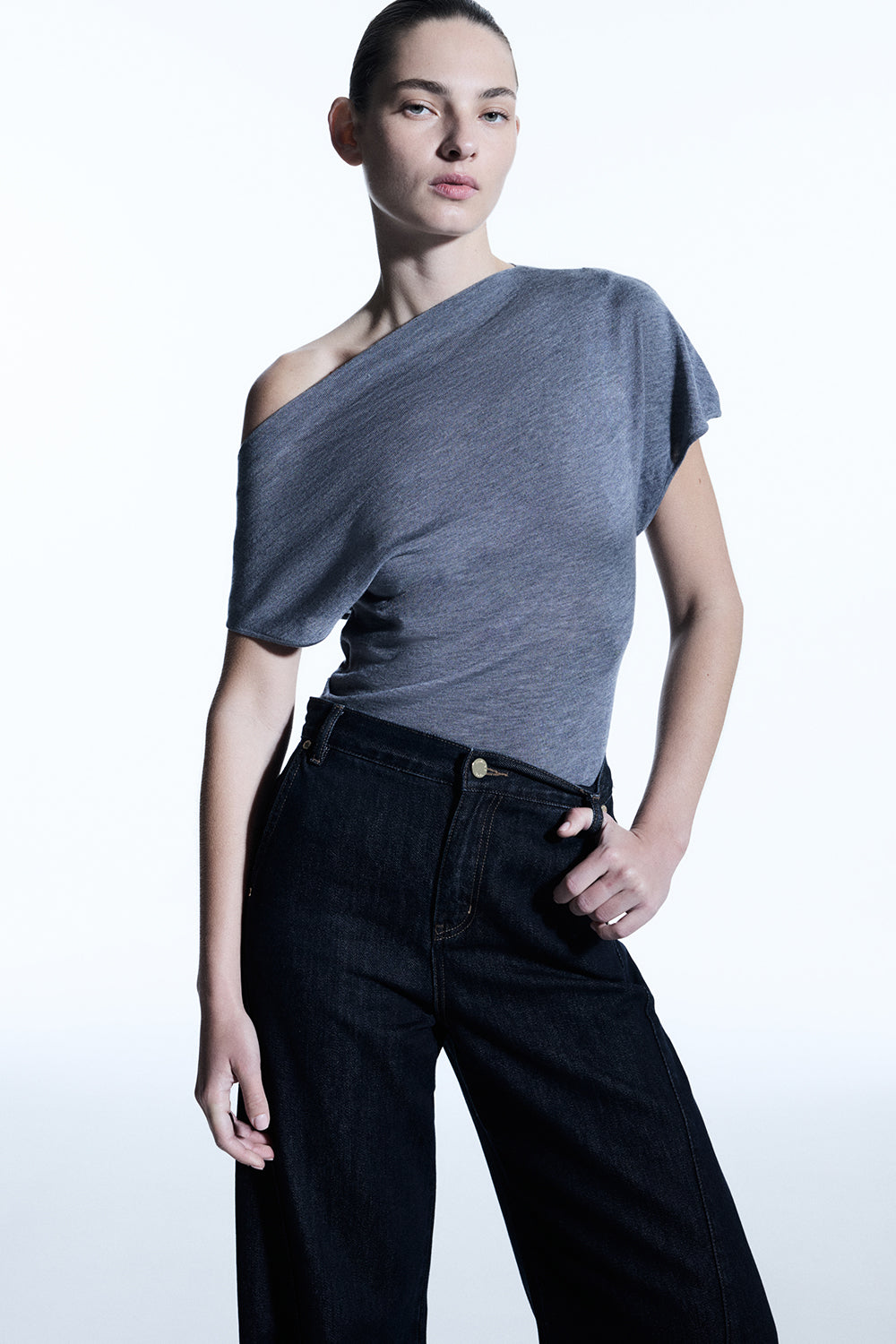 Image of a model wearing Tops. Productname: Melody Drape Knit in Graphite colour by brand - Manning Cartell