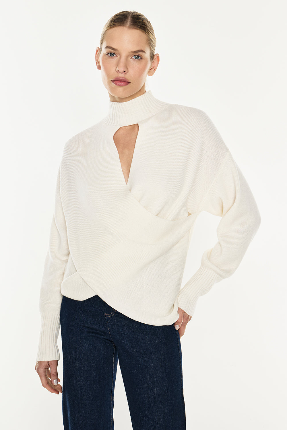 Image of a model wearing Tops. Productname: Style Smarts Knit Top in Ivory colour by brand - Manning Cartell