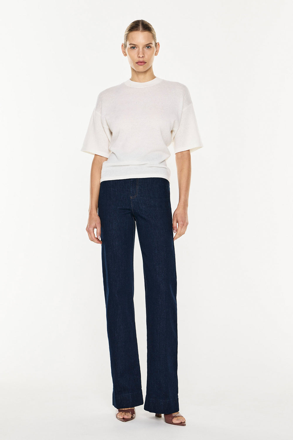 Image of a model wearing Tops. Productname: Light Years Knit Top in Ivory colour by brand - Manning Cartell
