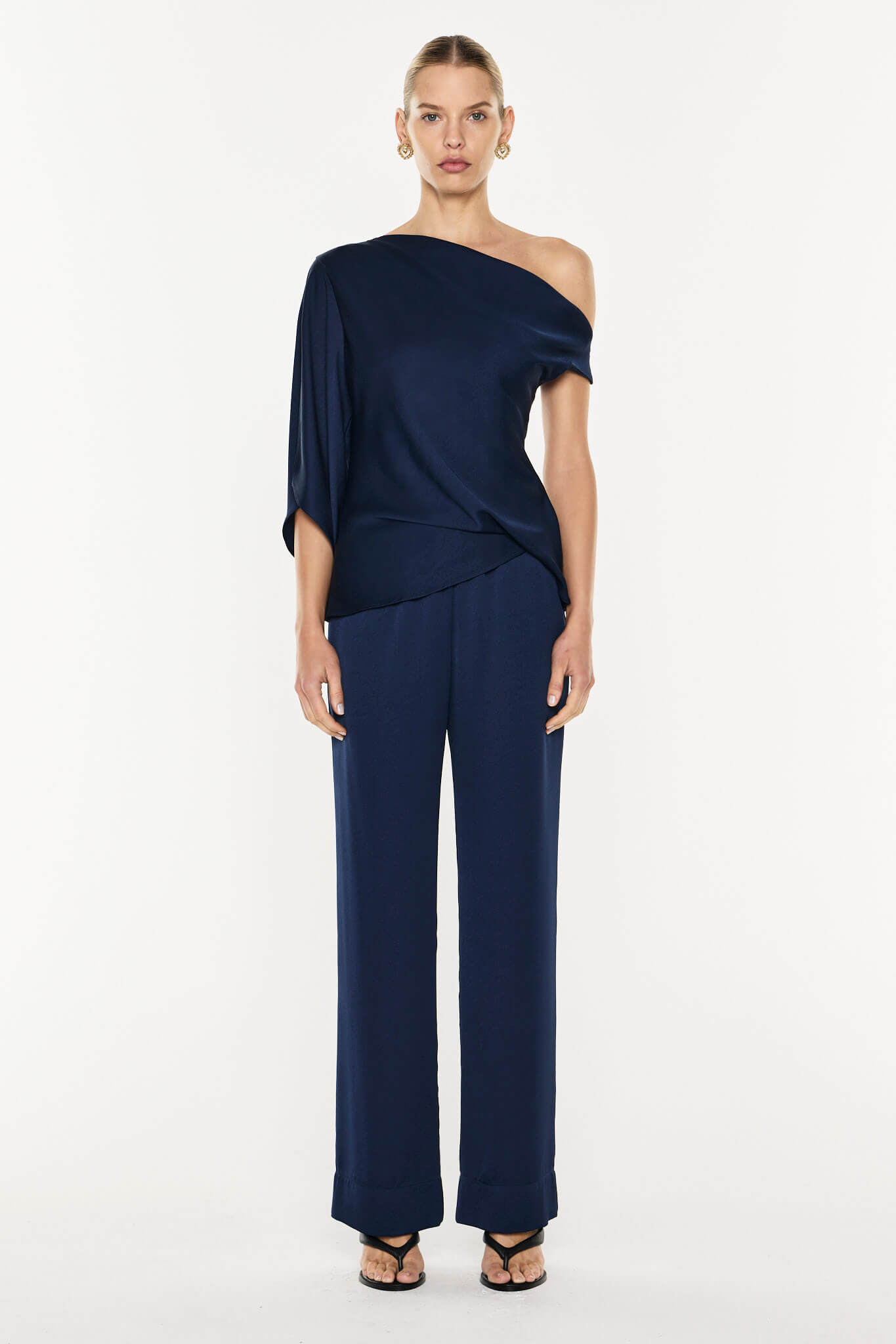 Image of a model wearing Tops. Product name - Twilights Kiss Top in Midnight Navy colour by brand - MANNING CARTELL