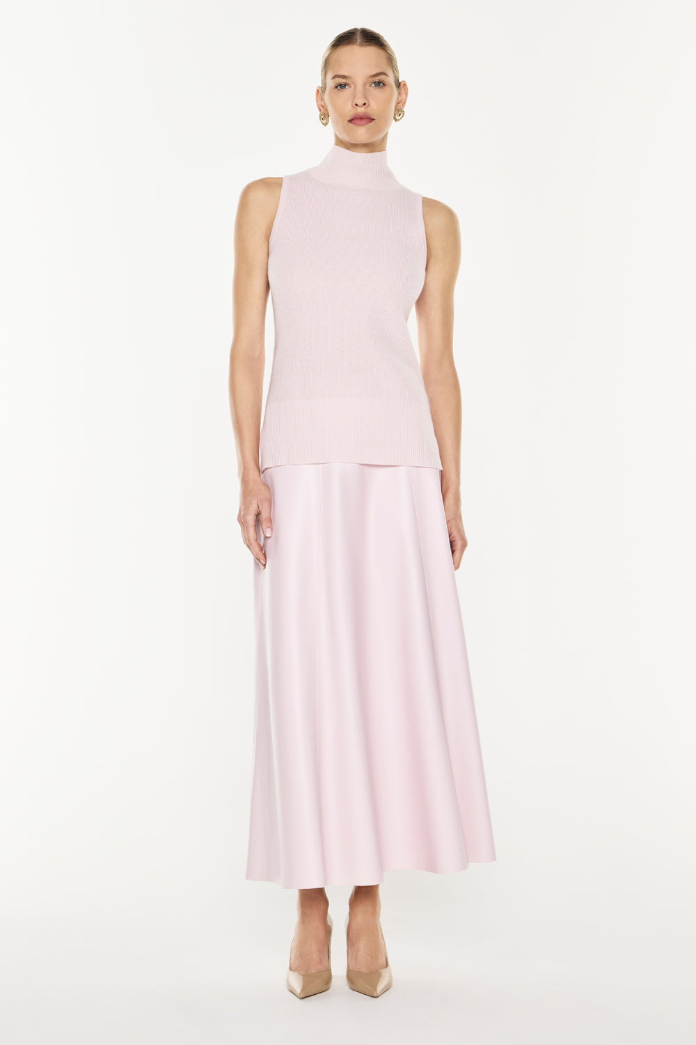 Image of a model wearing Tops. Productname: Funnel Vision Knit Top in Pink colour by brand - Manning Cartell