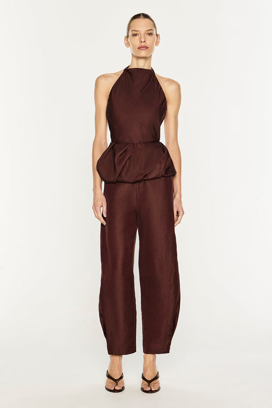 Image of a model wearing Tops. Product name - Rich Mix Peplum Top in Cocoa Brown colour by brand - MANNING CARTELL