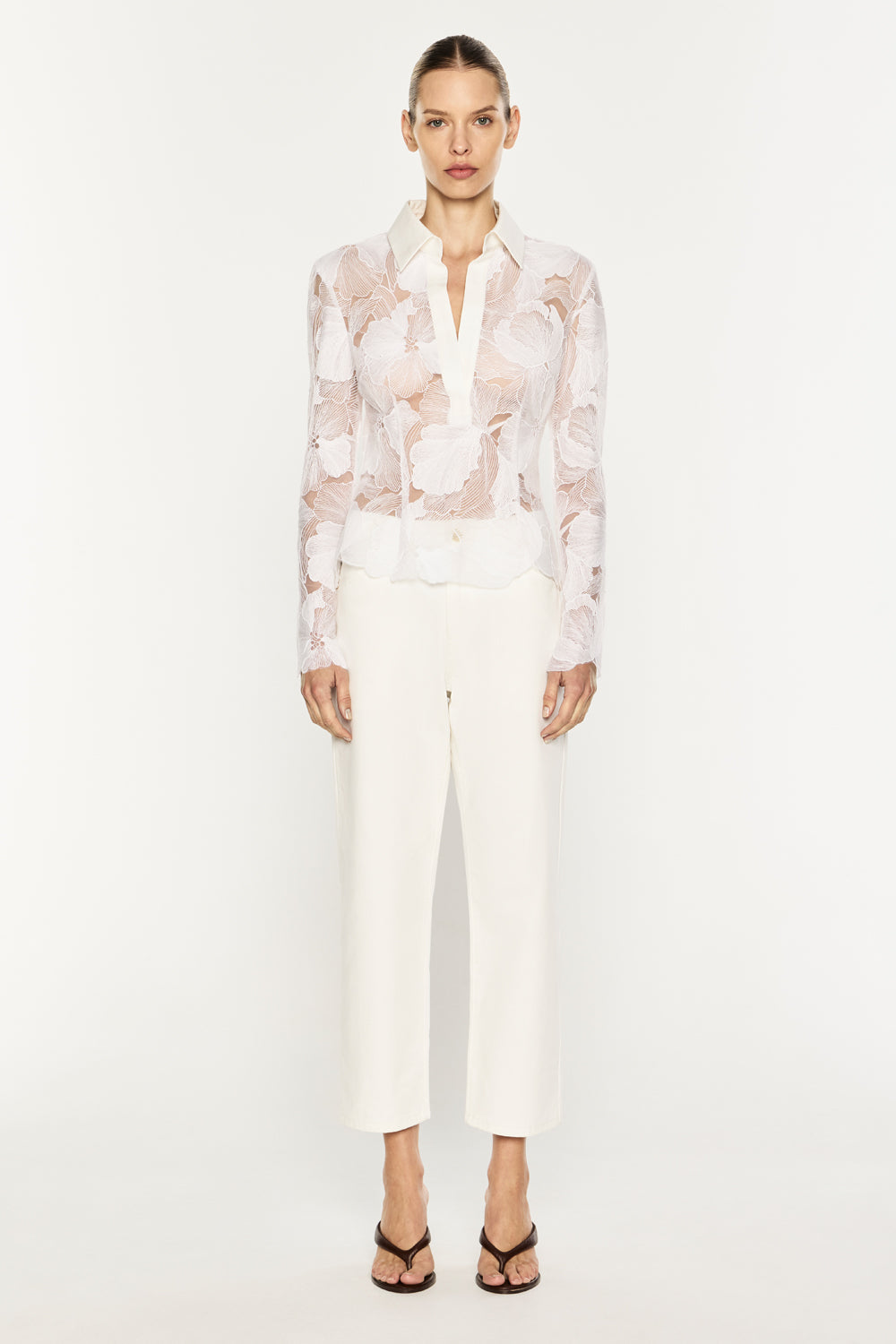 Image of a model wearing Tops. Product name - Sheer Force Polo Top in White colour by brand - MANNING CARTELL