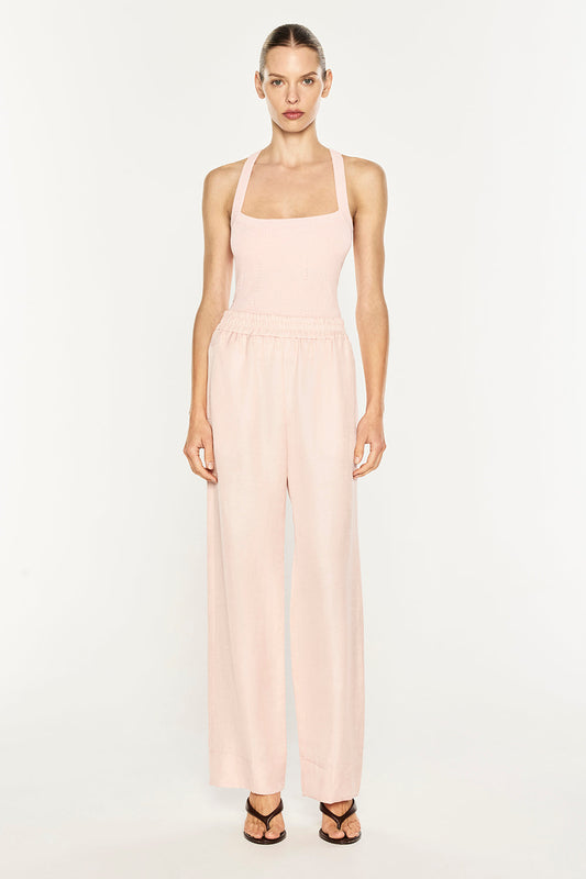 Image of a model wearing Pants. Product name - Rich Mix Pull On Pant in Blush Pink colour by brand - MANNING CARTELL