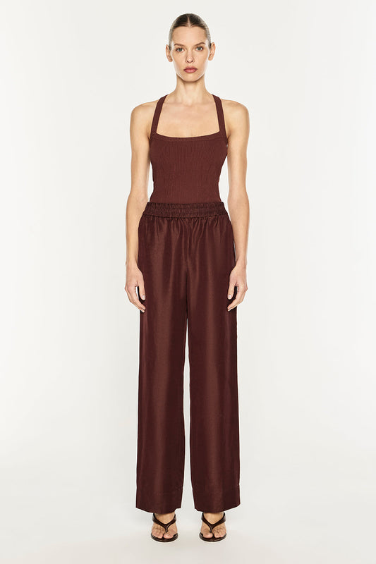 Image of a model wearing Pants. Product name - Rich Mix Pull On Pant in Cocoa Brown colour by brand - MANNING CARTELL