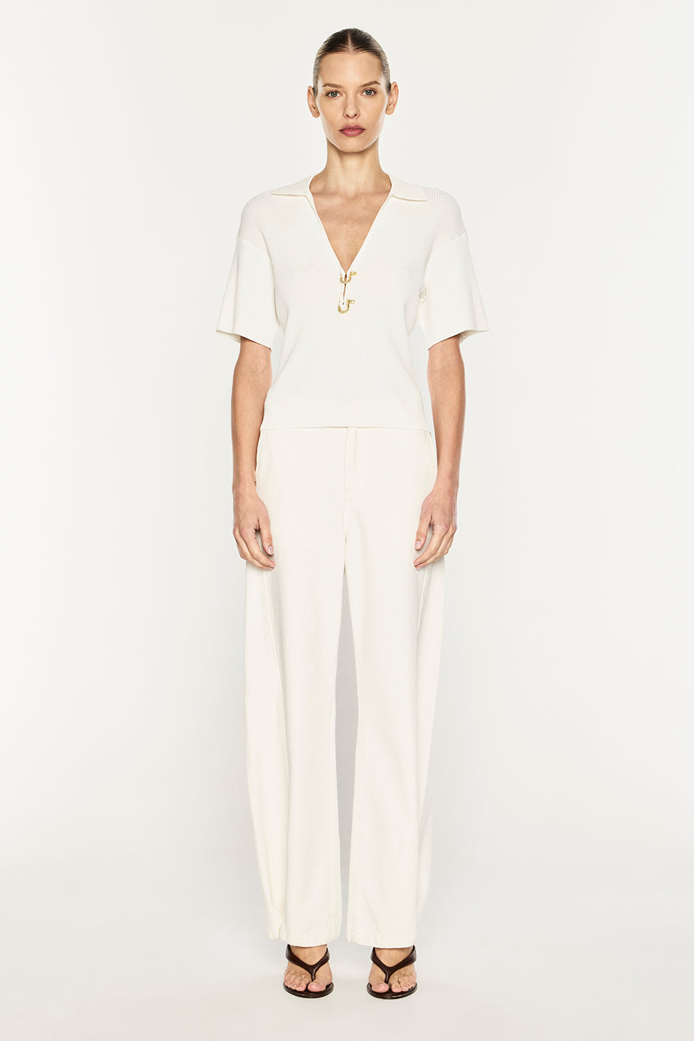 Image of a model wearing Tops. Product name - Nostalgia Trip Knit Polo in White colour by brand - MANNING CARTELL