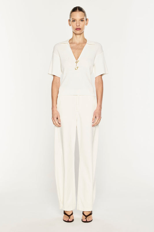 Image of a model wearing Tops. Product name - Nostalgia Trip Knit Polo in White colour by brand - MANNING CARTELL