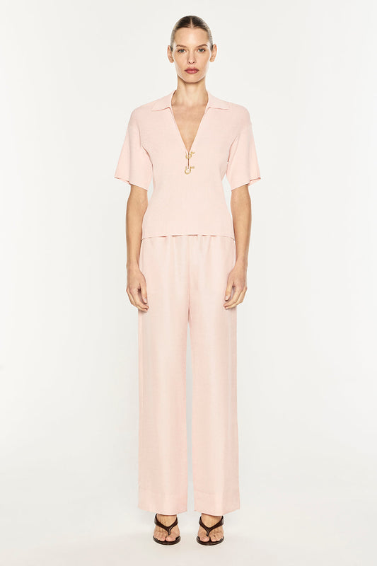 Image of a model wearing Tops. Product name - Nostalgia Trip Knit Polo in Blush Pink colour by brand - MANNING CARTELL