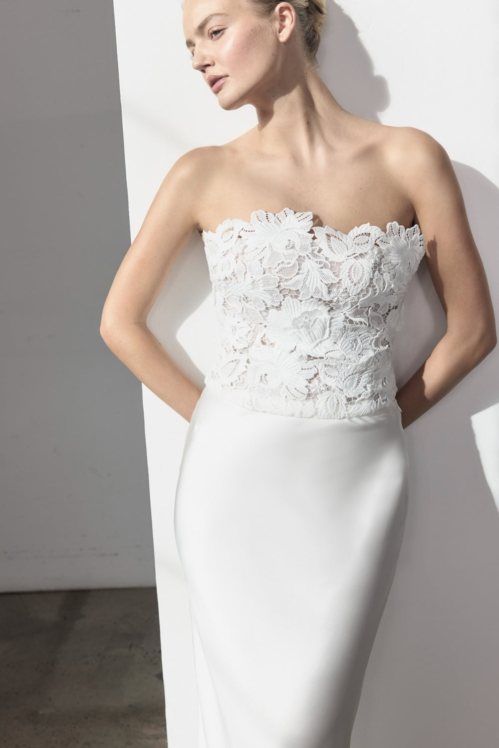Image of a model wearing Tops. Product name - Eternal Ties Bustier in White colour by brand - MANNING CARTELL
