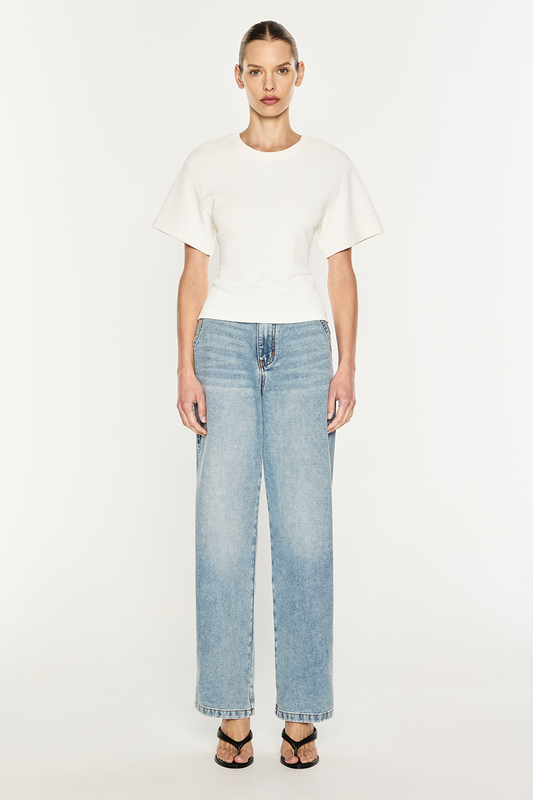 Image of a model wearing Tops. Product name - Triple Corset Tee in Ivory colour by brand - MANNING CARTELL