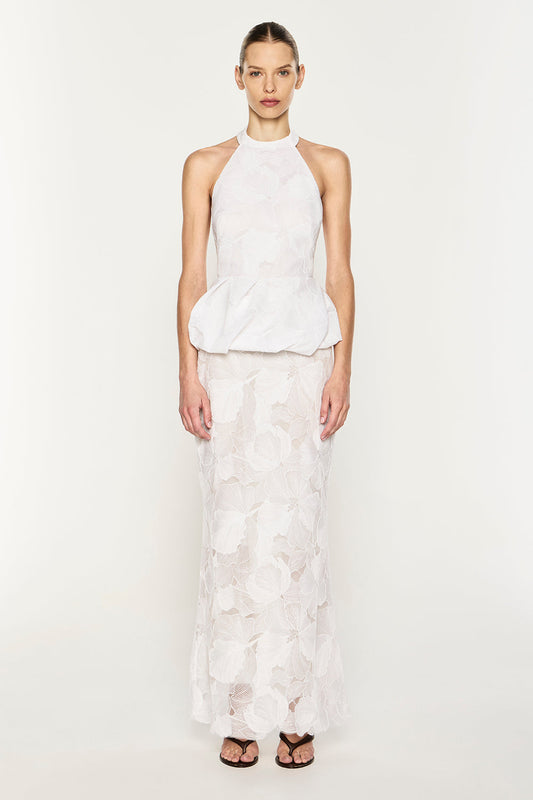Image of a model wearing Tops. Product name - Sheer Force Peplum Top in White colour by brand - MANNING CARTELL