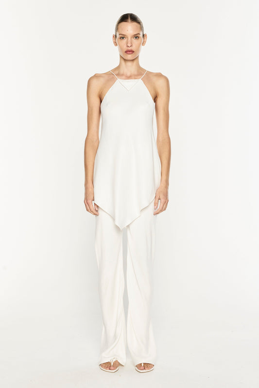 Image of a model wearing Pants. Product name - Oblique Bias Pant in White colour by brand - MANNING CARTELL
