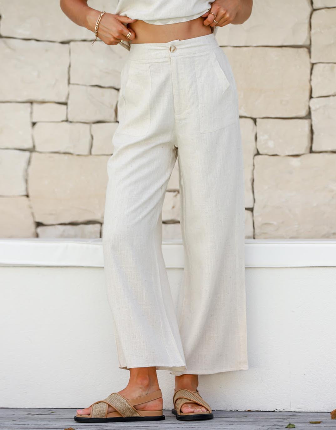 Image of a model wearing Pants. Product name - Anika Wide Leg Linen Pant Natural in Natural colour by brand - 132 Fashion