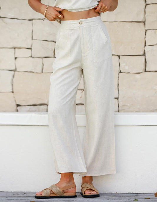 Image of a model wearing Pants. Product name - Anika Wide Leg Linen Pant Natural in Natural colour by brand - 132 Fashion