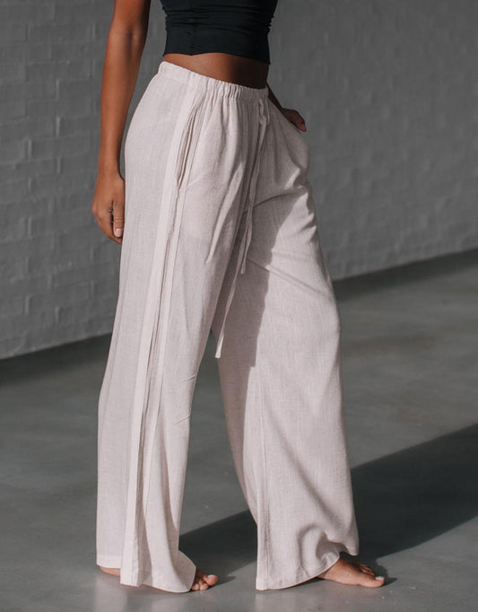 Image of a model wearing Pants. Productname: Berlin Racer Stripe Pant - in Natural/White colour by brand - 132 Fashion