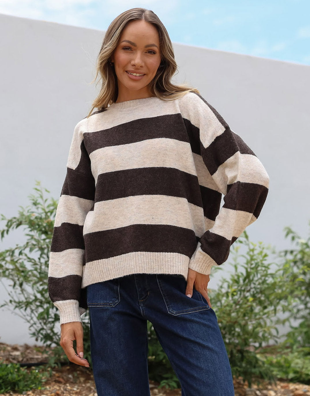 Image of a model wearing Outerwear. Product name - Frankie Knit Choco/Natural Stripe in Choco/Natural Stripe colour by brand - 132 Fashion