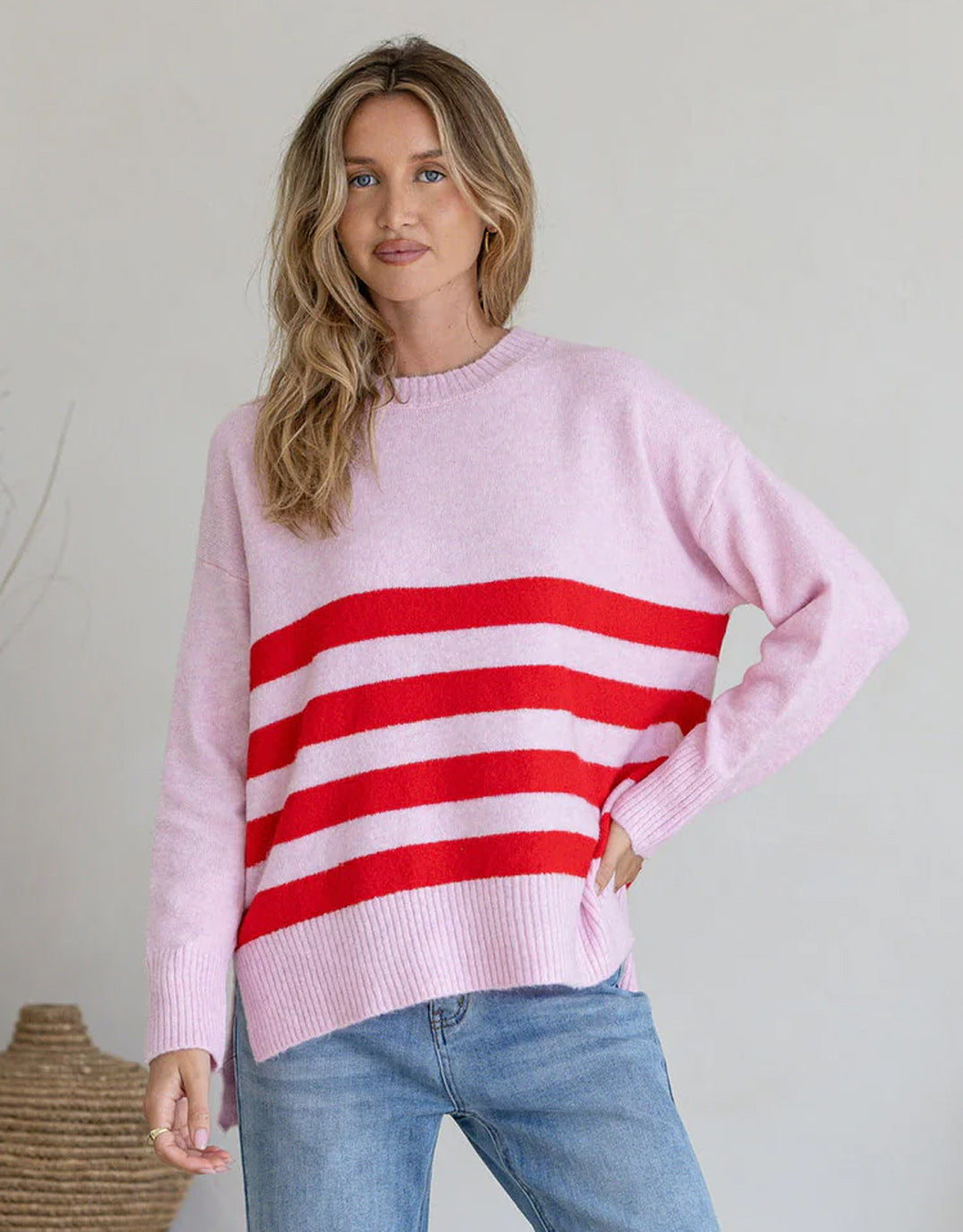 Image of a model wearing Outerwear. Product name - Manor Knit Pink/Red in Pink/Red colour by brand - 132 Fashion