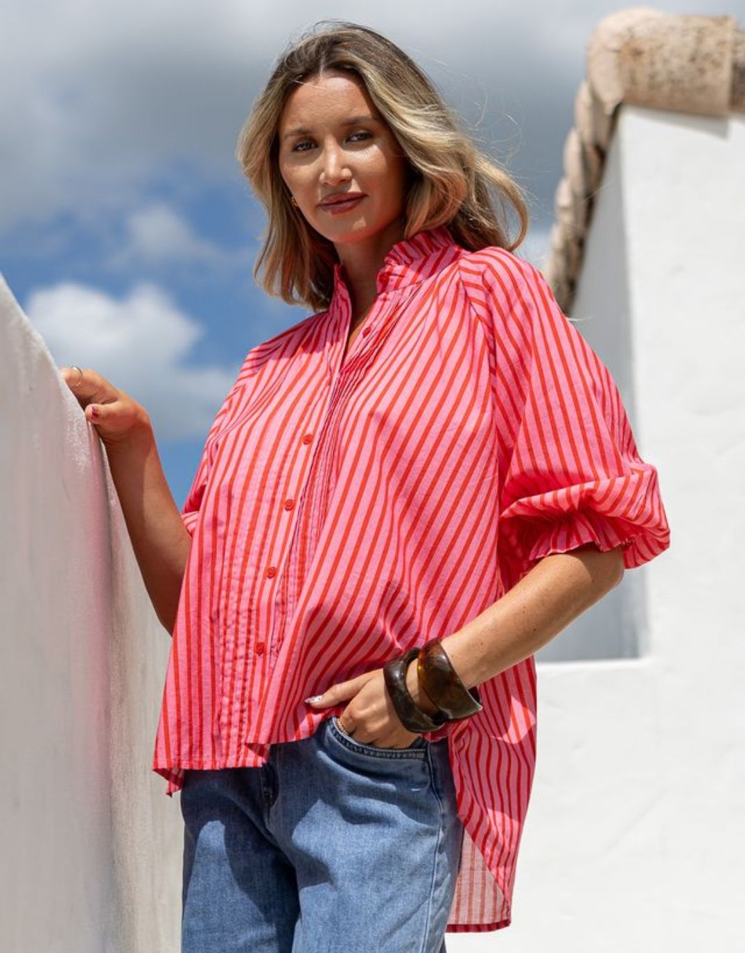 Image of a model wearing Tops. Productname: Margaret Stripe Blouse - in Pink/Red colour by brand - 132 Fashion