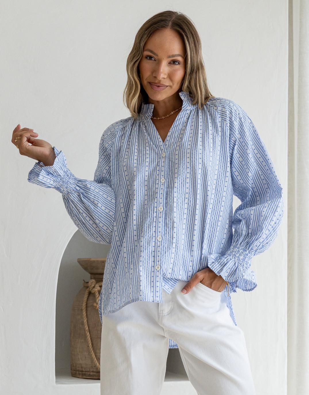 Image of a model wearing Tops. Productname: Mila Heart Stripe Blouse - in Powder Blue/White colour by brand - 132 Fashion