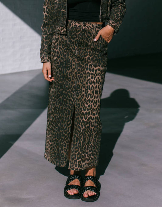 Image of a model wearing Skirts. Productname: Reese Stretch Denim Skirt - Leopard in Chocolate Leopard colour by brand - 132 Fashion