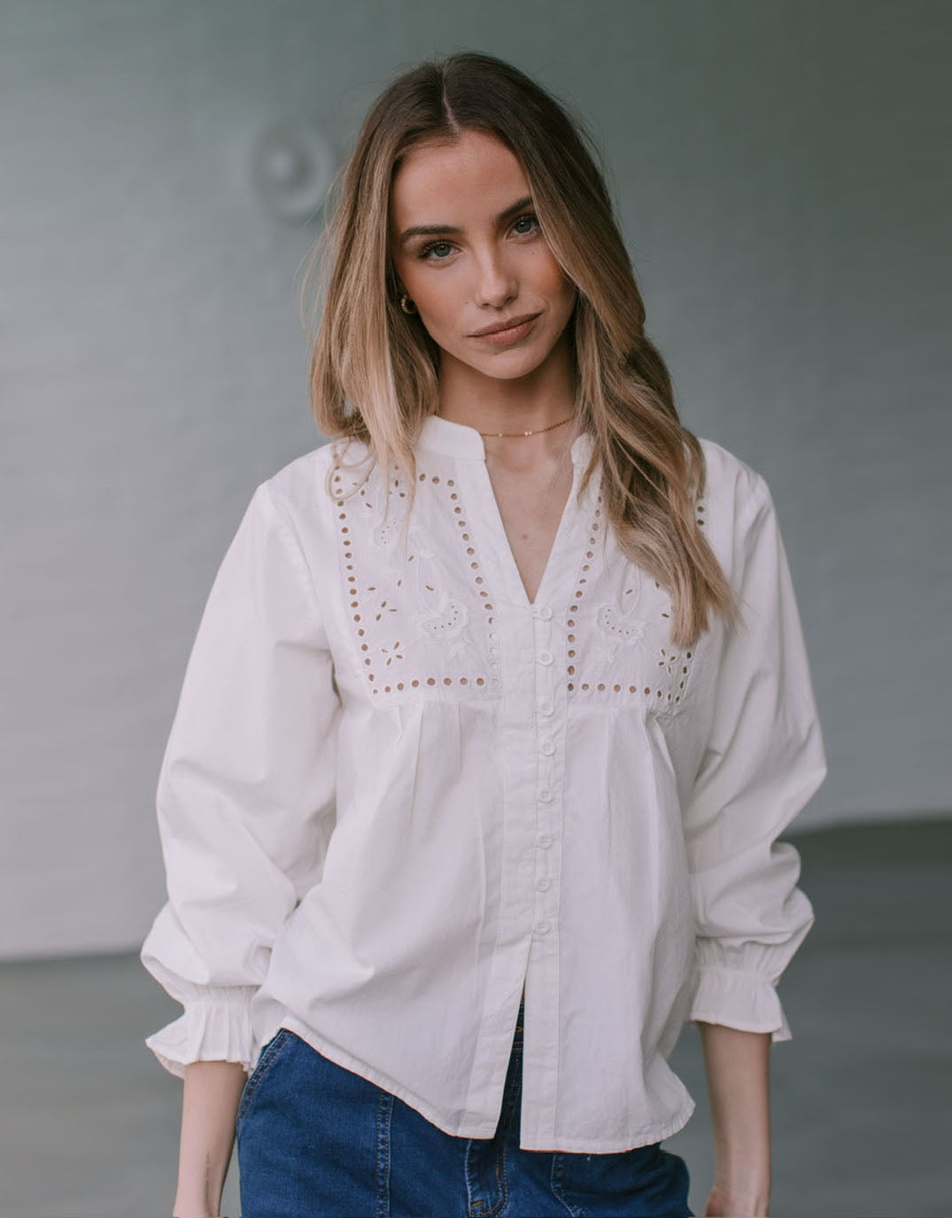 Image of a model wearing Tops. Productname: Whiskey Broderie Blouse - in White colour by brand - 132 Fashion