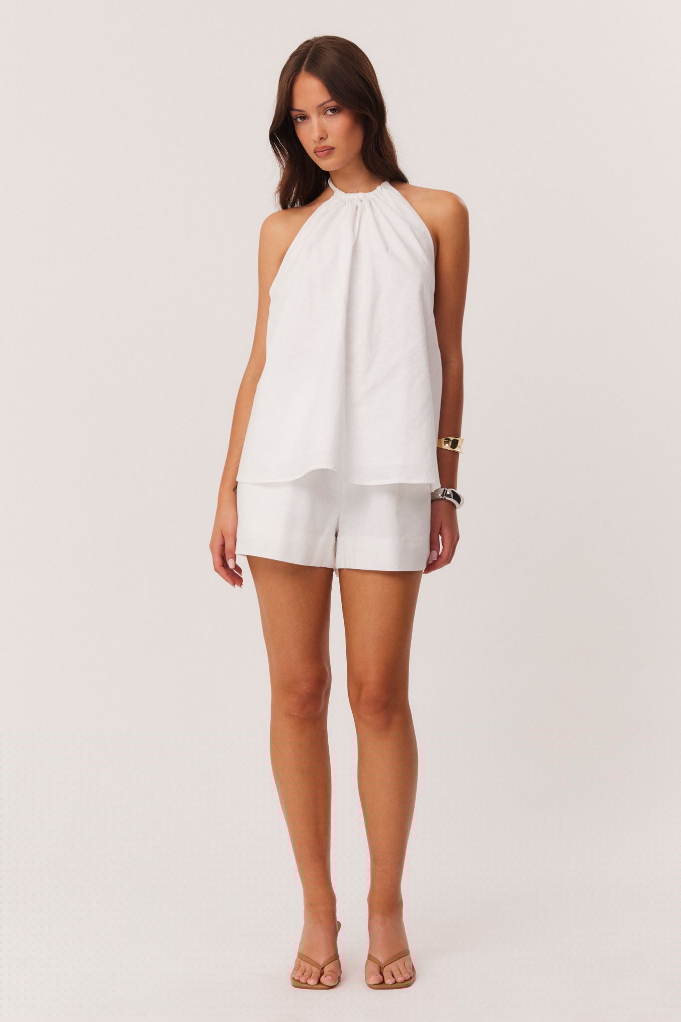 Image of a model wearing Shorts. Productname: SNDYS ISMENE SHORTS in White colour by brand - SNDYS