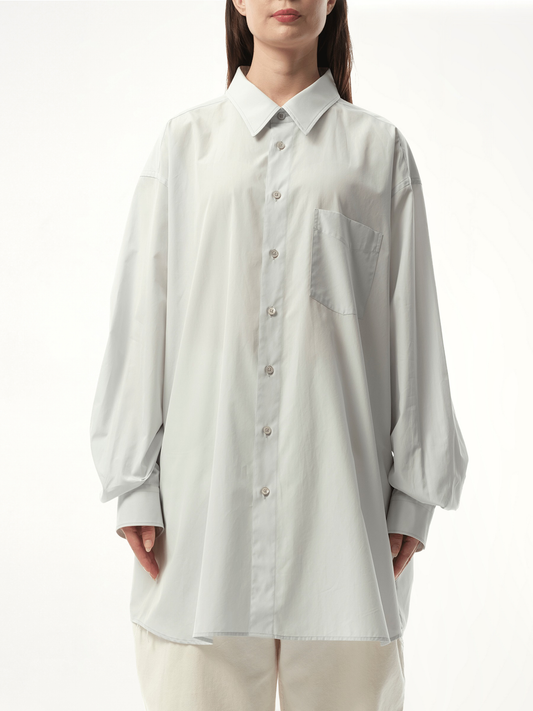 Image of a model wearing Tops. Productname: MAISON MARGIELA Long-sleeved Shirt in BLUE colour by brand - MAISON MARGIELA