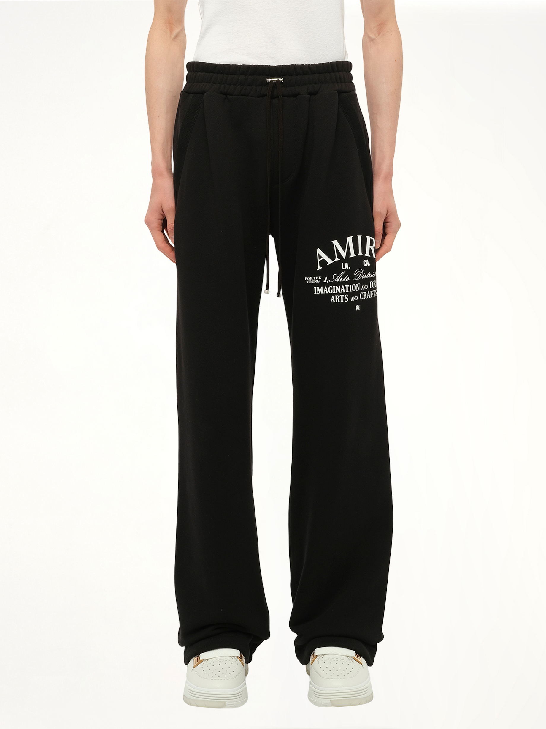 Image of a model wearing Pants. Productname: AMIRI Amri Arts District Sweatpant in Black colour by brand - AMIRI