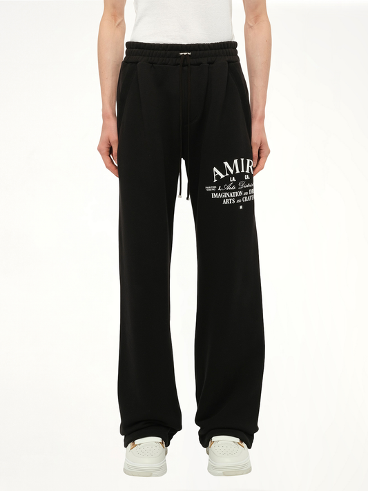 Image of a model wearing Pants. Productname: AMIRI Amri Arts District Sweatpant in Black colour by brand - AMIRI