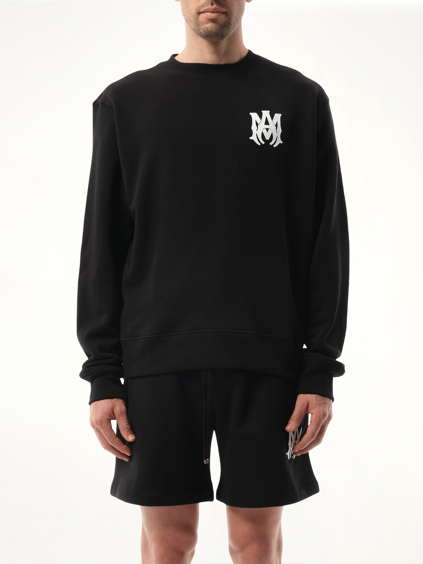 Image of a model wearing Outerwear. Productname: AMIRI MA Core Logo Sweatshirt in Black colour by brand - AMIRI