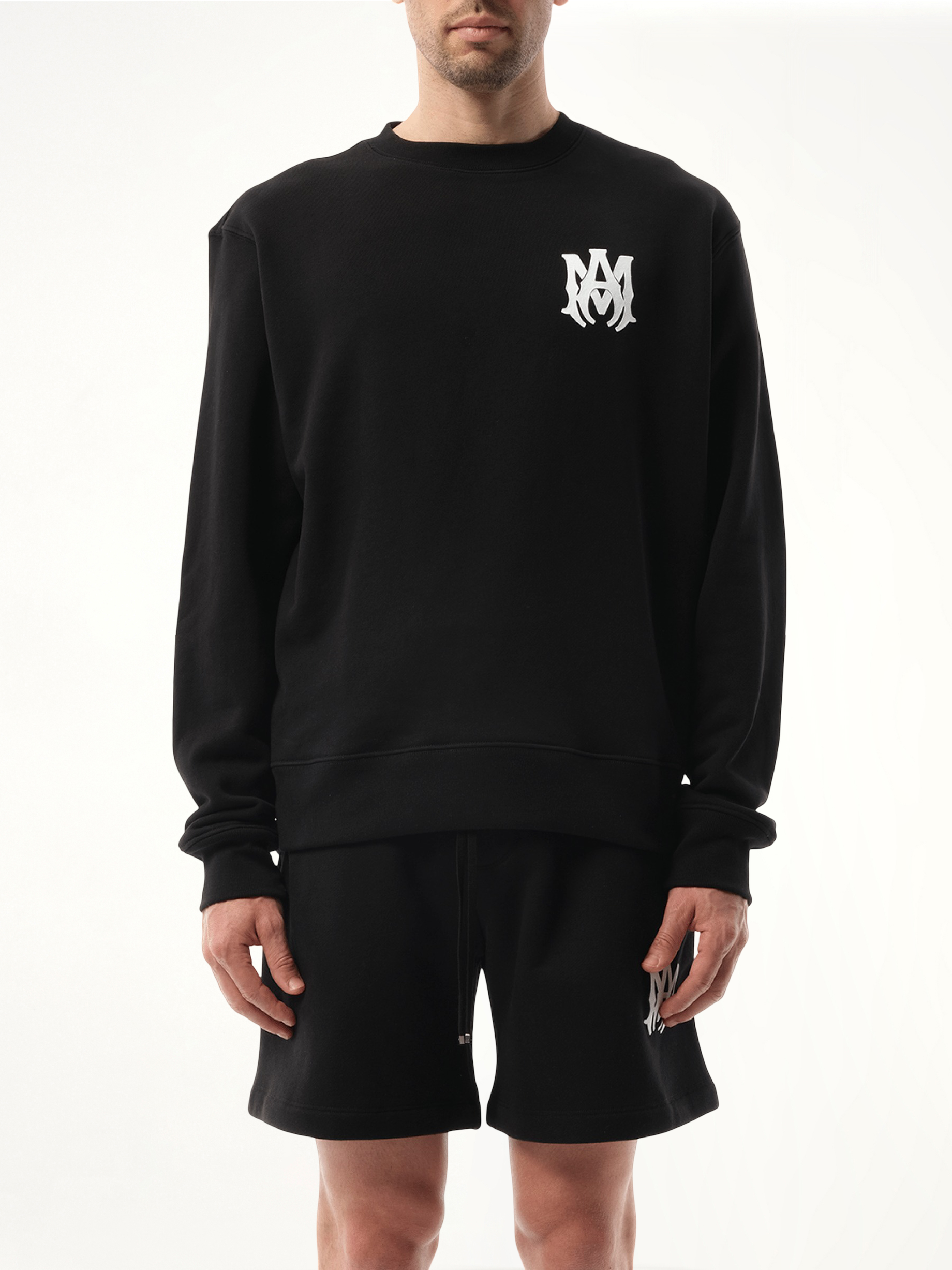 Image of a model wearing Outerwear. Productname: AMIRI MA Core Logo Sweatshirt in Black colour by brand - AMIRI