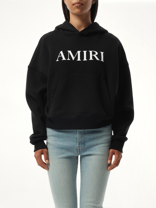 Image of a model wearing Outerwear. Productname: AMIRI Amiri Core Logo Hoodie in BLACK colour by brand - AMIRI