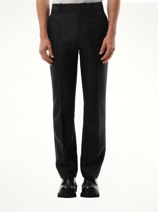 Image of a model wearing Pants. Product name - Slim Fit Trouser in Black colour by brand - LOEWE