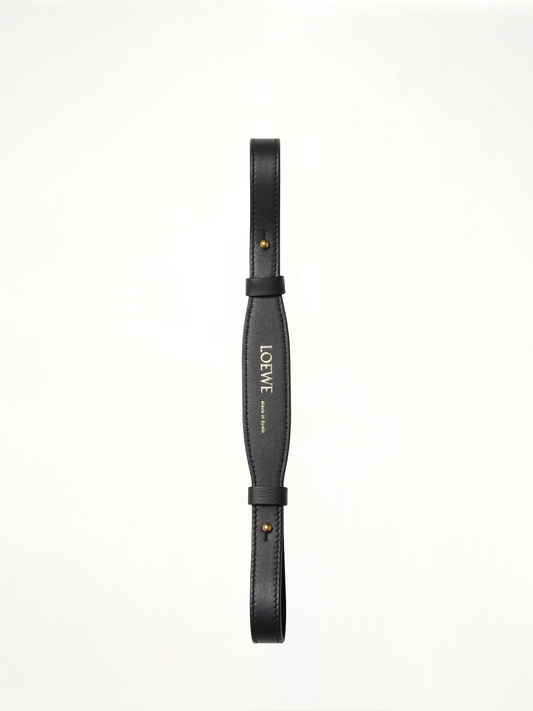Image of a model wearing Shorts. Product name - Branded Short Strap in Black colour by brand - LOEWE