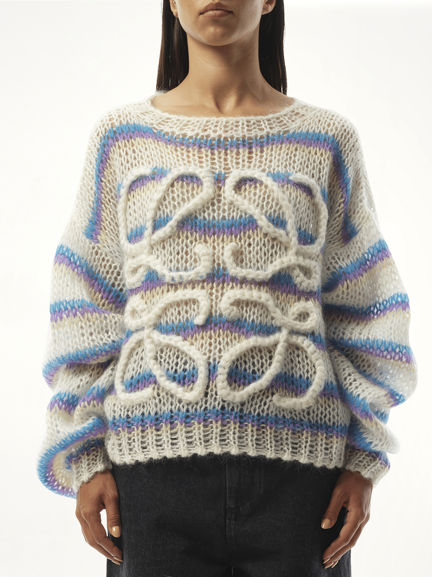 Image of a model wearing Outerwear. Product name - Relaxed Fit Anagram Sweater in White colour by brand - LOEWE