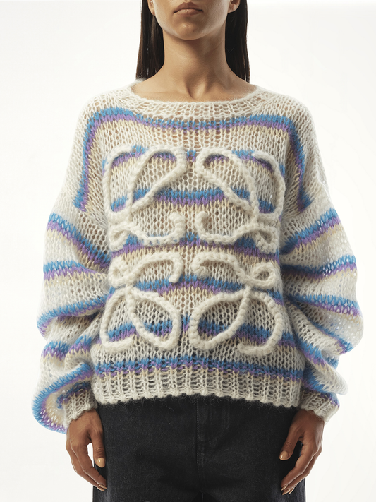 Image of a model wearing Outerwear. Product name - Relaxed Fit Anagram Sweater in White colour by brand - LOEWE